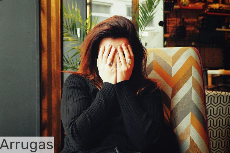 woman in black long sleeve shirt covering her face